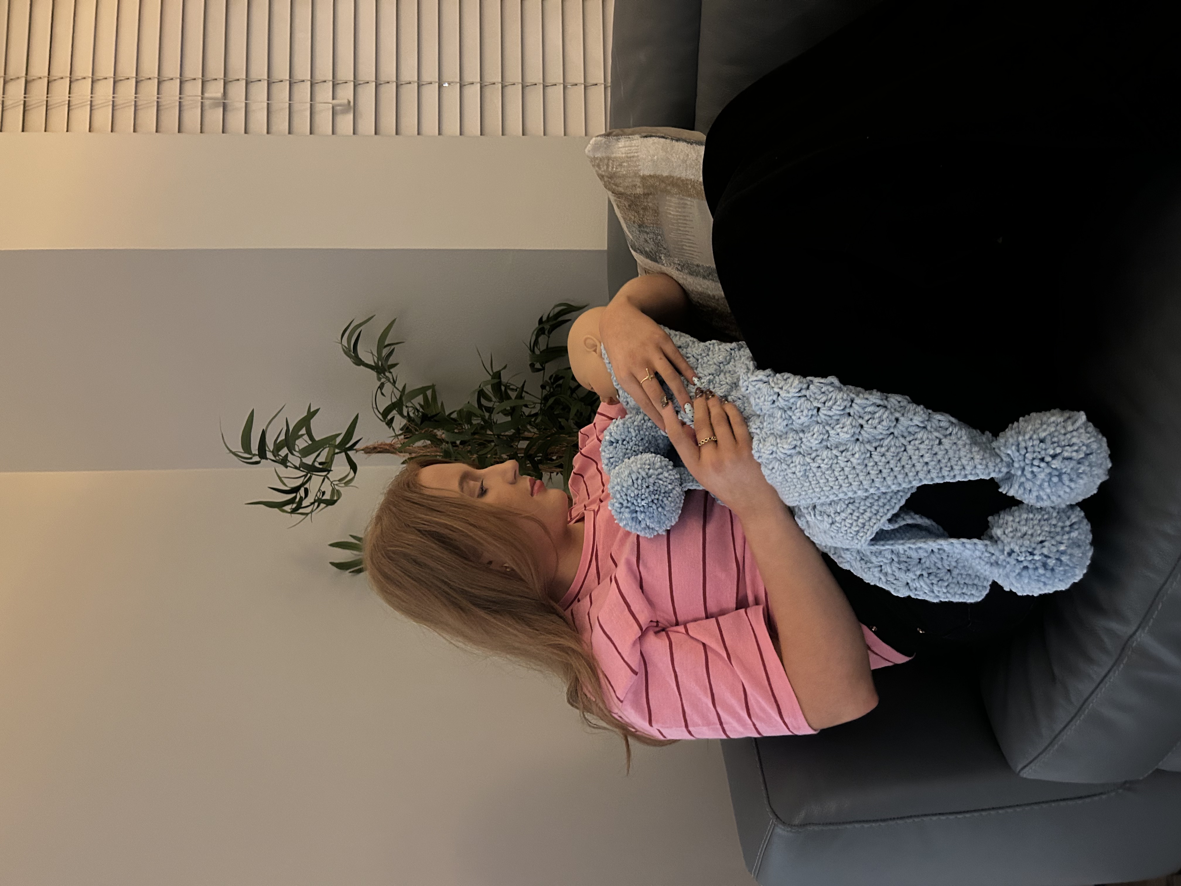 Striped crochet blanket on sofa